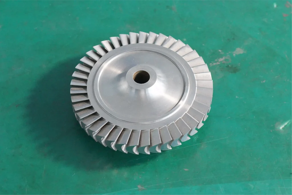 CNC machined metal part with turned circular features, milled faces, and precision holes for process-route review.
