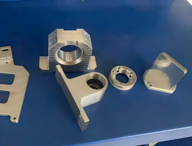 Custom CNC machined metal parts including brackets, housings, plates, and flange components for prototype and low-volume production.