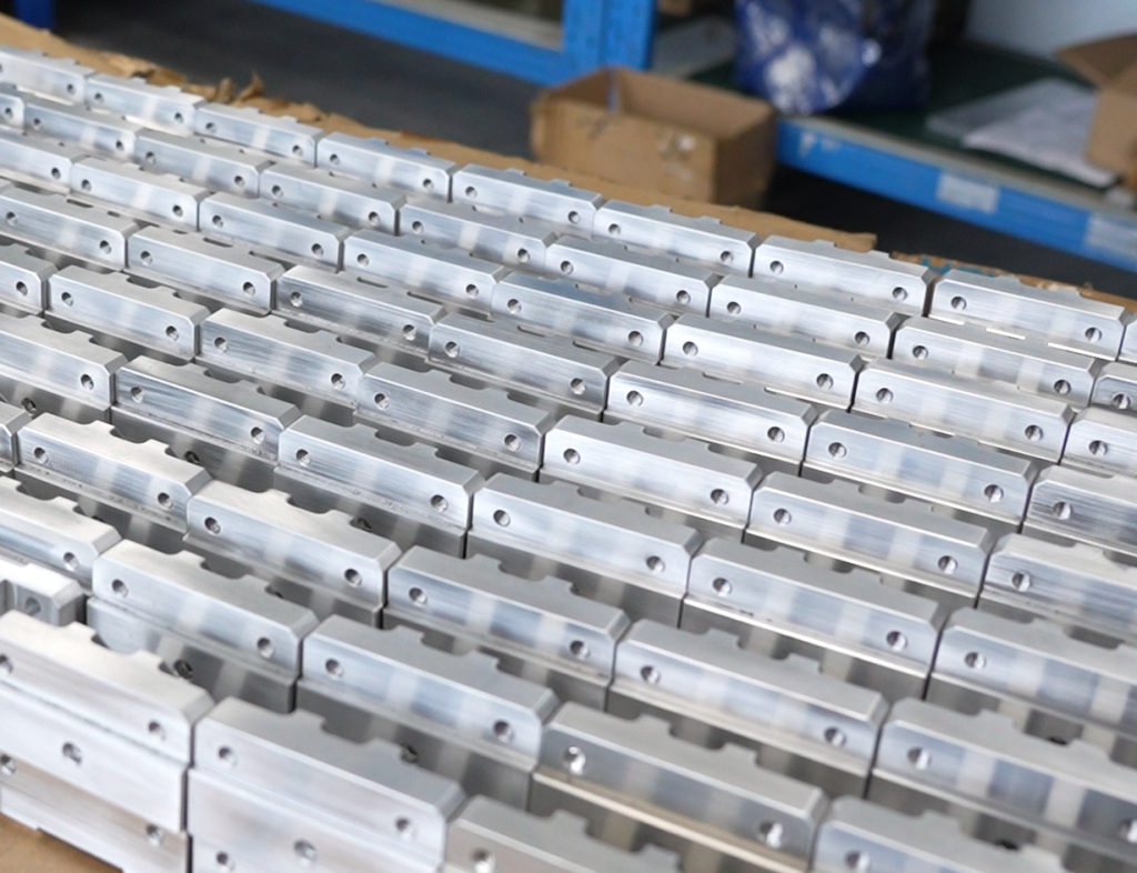 Low-volume batch of CNC machined aluminum brackets prepared for inspection and delivery.