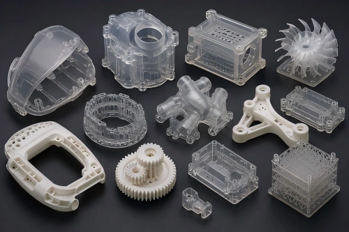 SLA 3D printed detailed prototype parts with transparent and white resin models, fine features, smooth surfaces, housings, gears, and fit-check components.