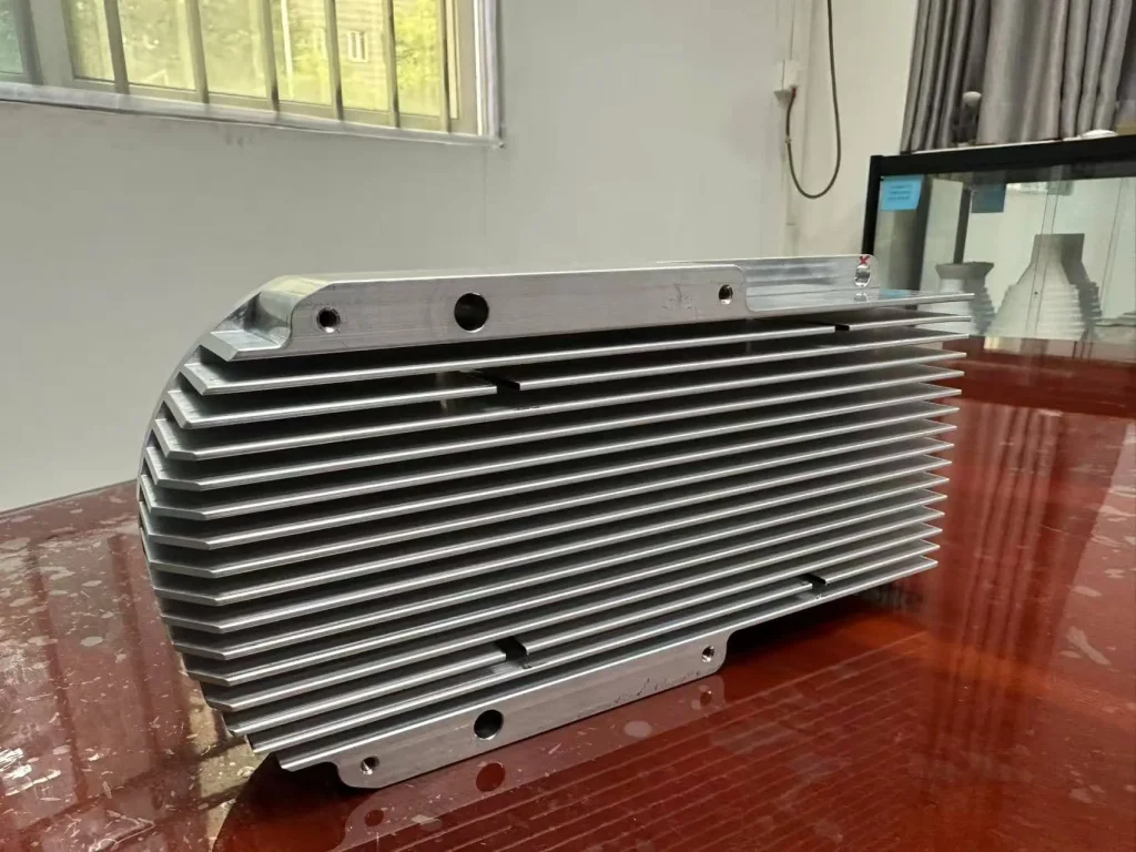 Large CNC machined aluminum heatsink with tall thin fins showing rigidity and deformation risks.