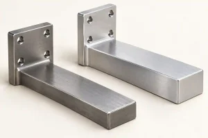 Illustration of two metal support brackets with matching four-hole mounting flanges and different arm thicknesses.
